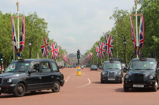 Cabs on the road with British flags