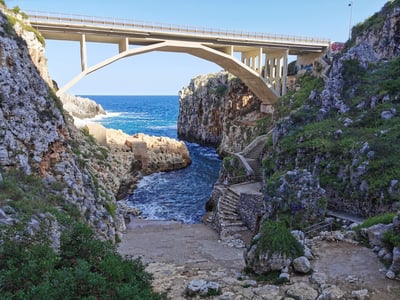 Bridge between mountains at sea in Italy