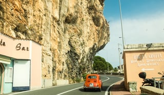 A red car on an Italian road