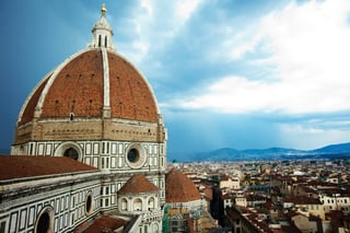 The dome and roof of a classical church in Italy
