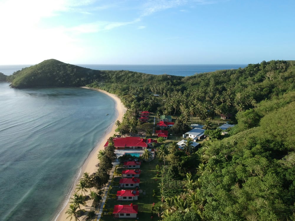 Bay with buildings and red roofs in Fiji