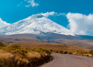 Road through the landscape of Ecuador to the snowy mountains
