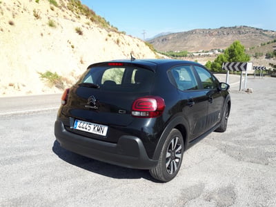 Dark car parked near mountains in Spain
