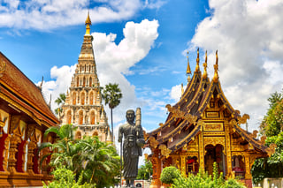 Asian temples and statues in a tropical environment