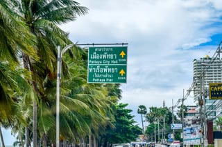 Roadsign in Thai and English in Thailand